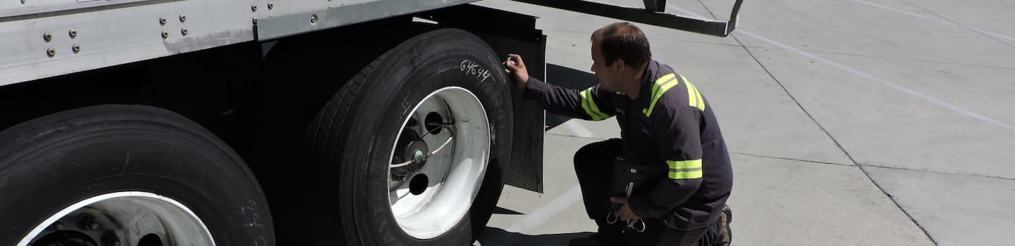 Mckinney-maintenance-technician-inspecting-trailer