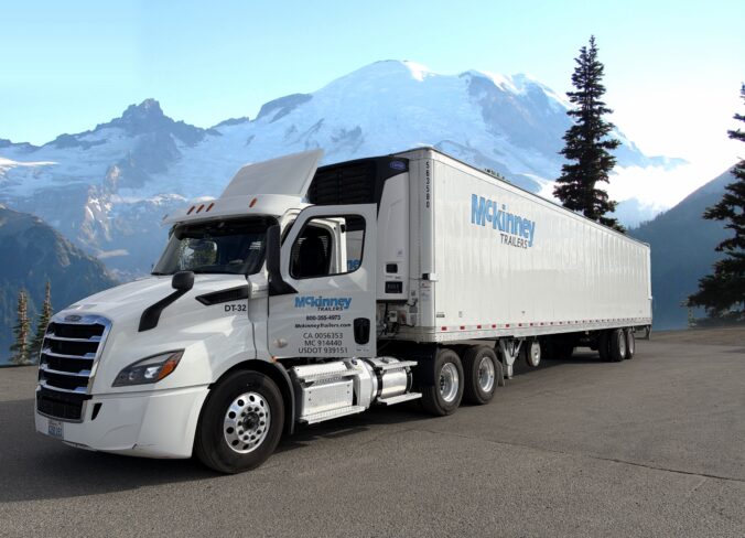 A truck with Mckinney trail with Mt. Rainier in the background.